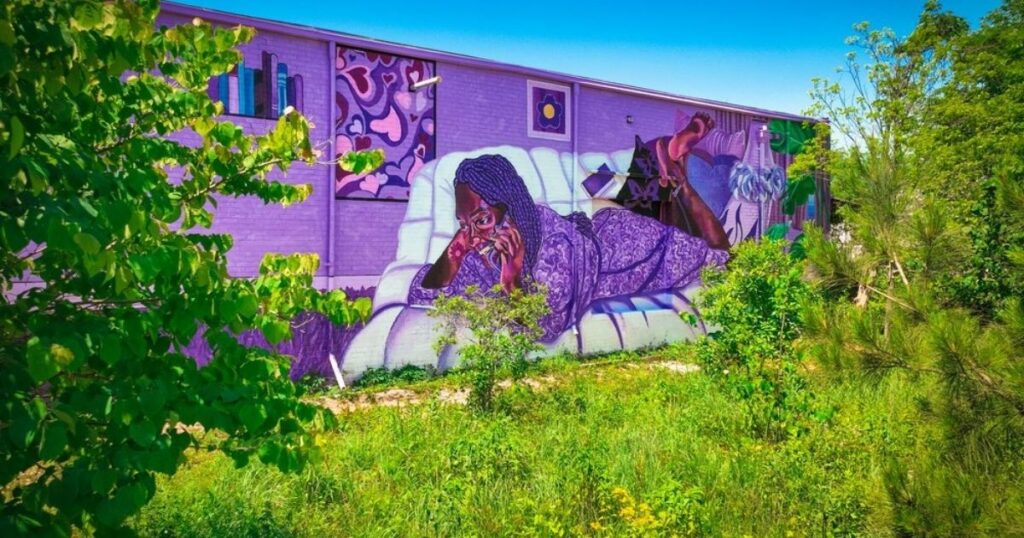 beautiful mural on building by Living Walls project in Atlanta
